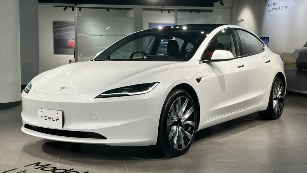 White Tesla Model 3 electric sedan, front three-quarter view